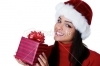 stock-photo-14237268-woman-wearing-santa-hat-and-holding-a-gift.jpg